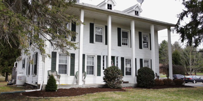  A turn-of-the-century Colonial with a newer 4-car garage and horsebarn with pasture. A perfect country estate. 