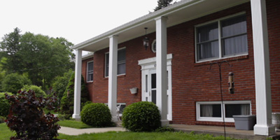 A solidly-built and meticulously updated brick home just a couple minutes from Upper Front Street.