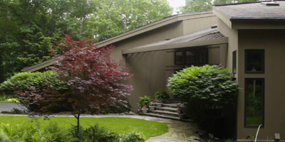 A stunning custom-built Contemporary on a private lot on Binghamton's South Mountain.