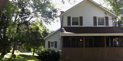 A fully renovated home on a large park-like yard with plenty of garage and storage space.