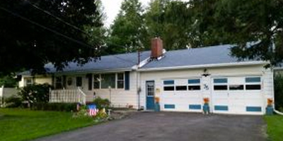 Beautiful 1-level living Ranch on 1.8 acres with an in-ground pool and extensive landscaping.