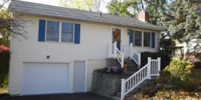 A lovely Ranch on a well landscaped lot featuring a pool.