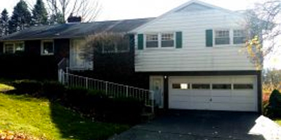 A huge Ranch with 4 bedrooms, 2 baths and a walk-out lower level with Summer kitchen.
