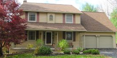 A spacious Colonial-style home with a finished walk-out lower level.