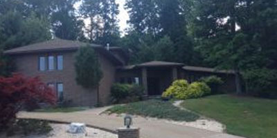 An expansive and luxurious brick contemporary home with low property taxes.