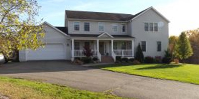 A huge newer country home with acreage and privacy.