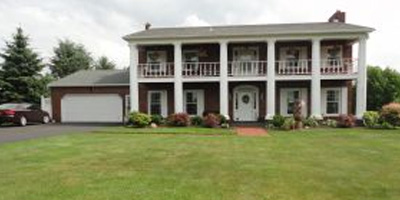 A unique and stylish Center Hall home with fantastic views.