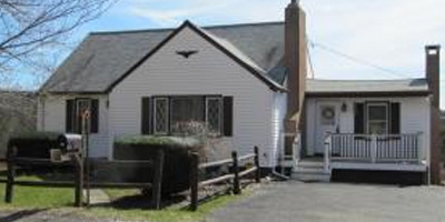 A spacious Cape Cod with a large yard and outbuildings. Close to BU!