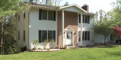 A well-decorated and maintained 2-story home on a local-traffic street.