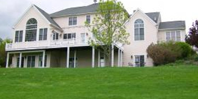 An expansive bed and breakfast, overlooking a golf course, with up to 9 beds and 10 baths.