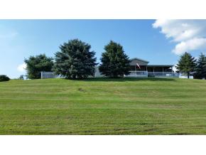 A spectacular 16 acres with large home, beautiful pond, and a fully restored and updated barn.