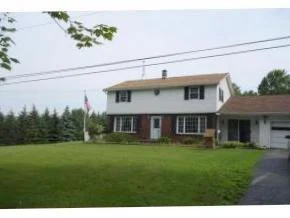 A spacious home on a lovely country lot. In-ground pool and over 1.5 acres!