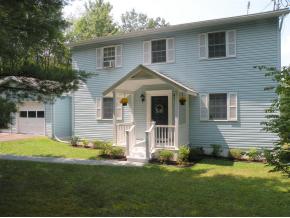 A spacious 2-story home a private, country lot with a new kitchen.