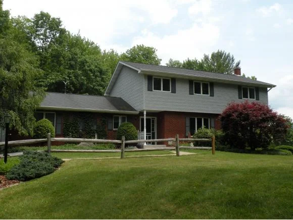 A spectacular country estate with an updated home and horse barn.
