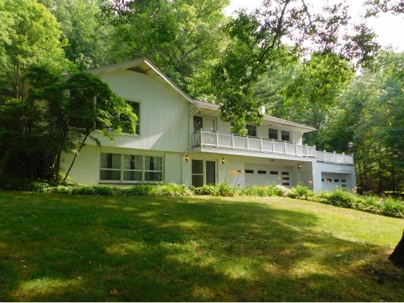 An updated spacious home with cathedral ceilings on 6.42 acres.