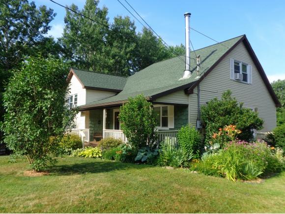 A spacious split level on well-manicured acreage. 