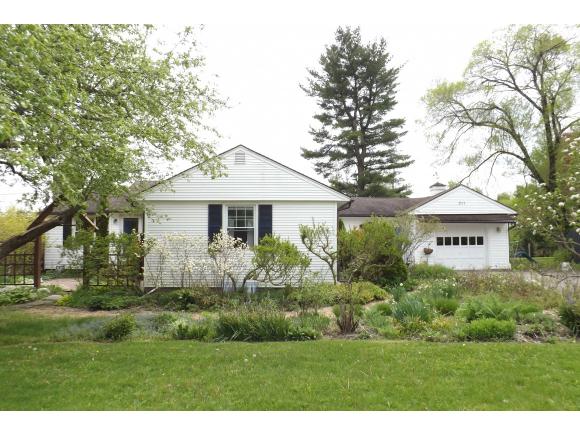A lovely ranch home on a half acre full of mature gardens and beautiful courtyards.