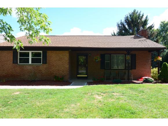 A spacious brick ranch with a newer kitchen and nice yard.