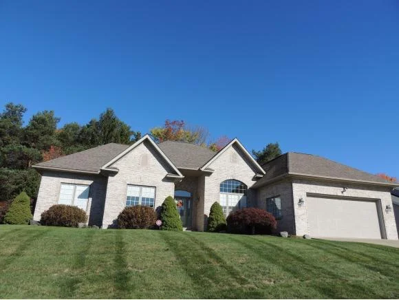 A stately brick Contemporary Ranch overlooking the beautiful river valley.