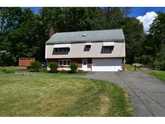 A spacious Raised Ranch with a big yard and hot tub.