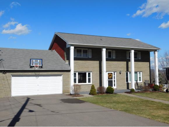 An immaculate 2-story with a first-floor master suite, 3 levels of living, and an in-ground pool.
