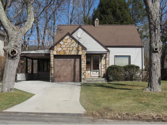 An immaculate Cape Cod with classic details on a scenic, level lot.
