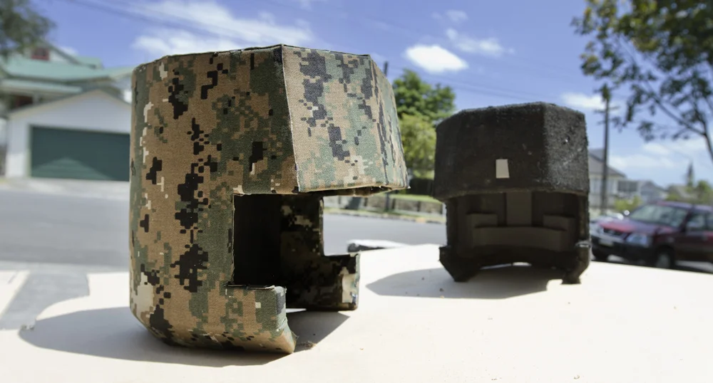 After finalizing the foam construction, tactical fabric was sprayed glued to the foam, then aged.