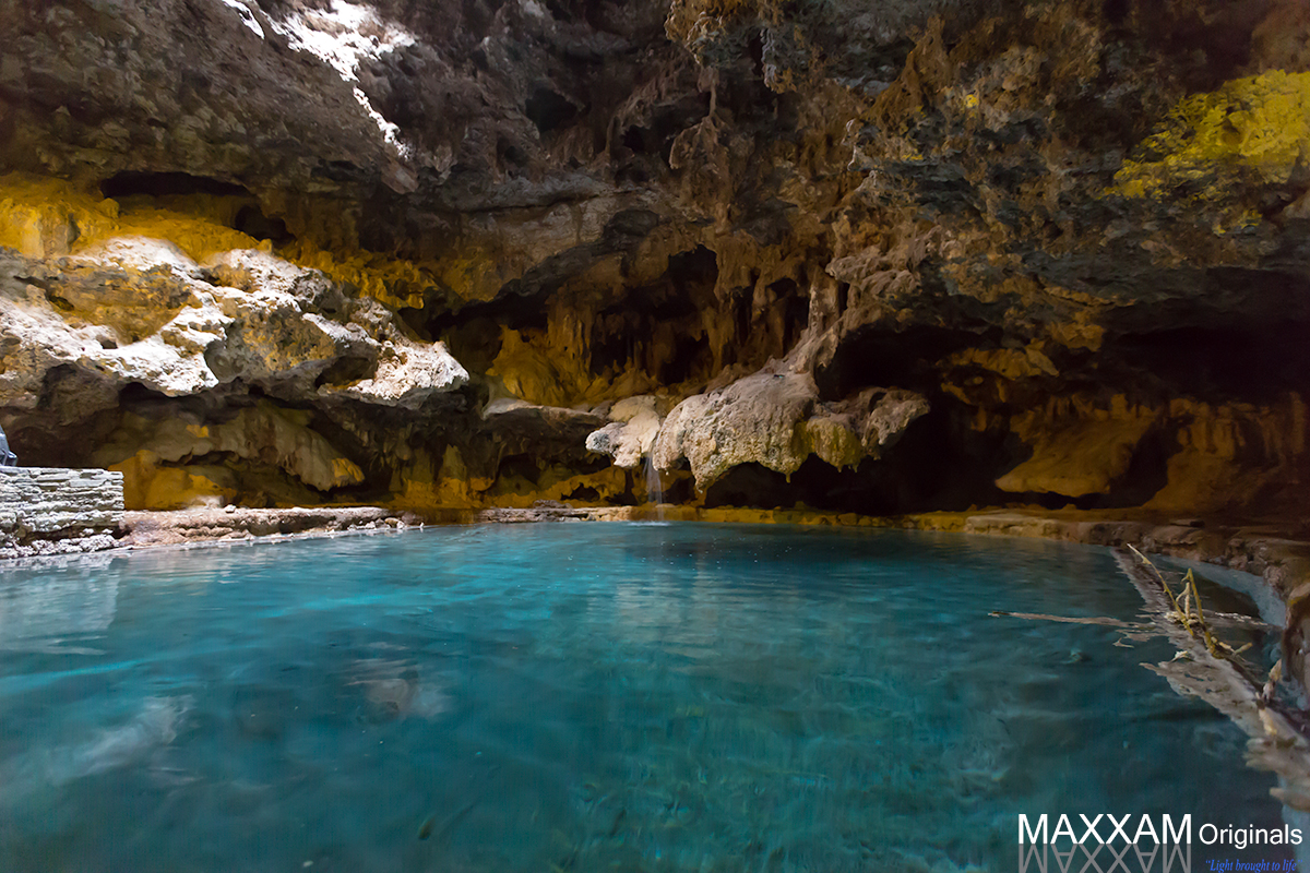 A pool of water deep within a cave. This desperately high ISO shot was captured in the relative darkness, lit only from the hole in the rock ceiling above.