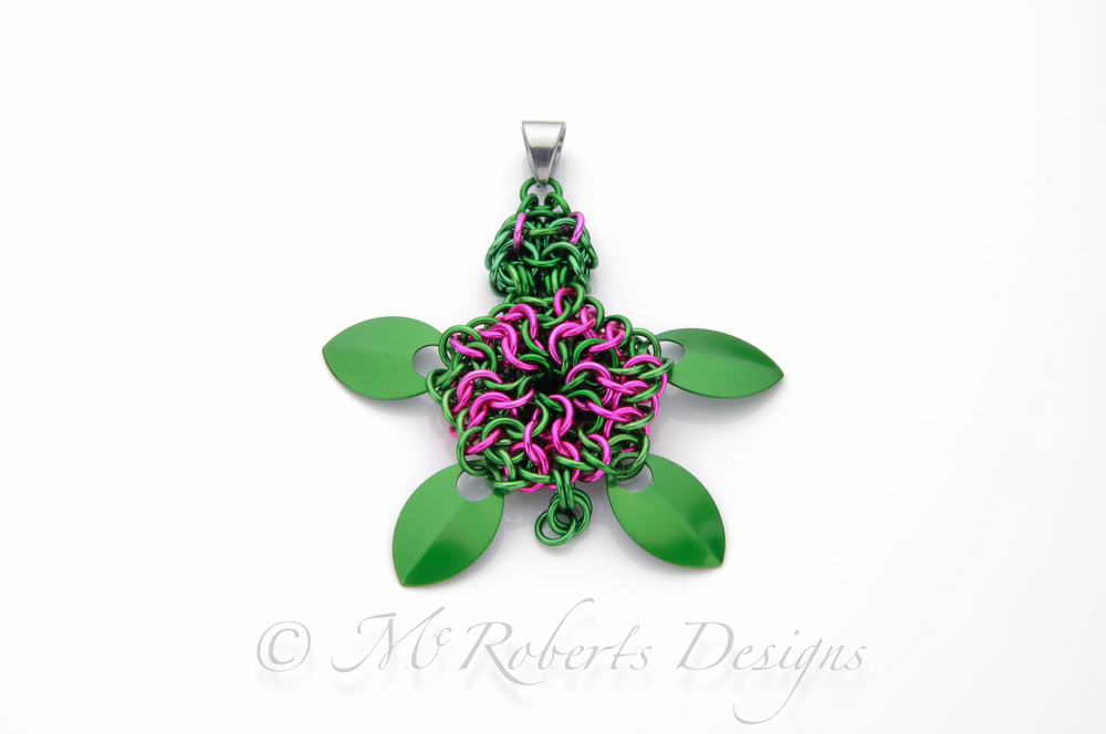 This is an original design. Originally based on the Delta Zeta sorority's pink and green turtle mascot. This is made with over 100 individual Anodized Aluminum rings. 