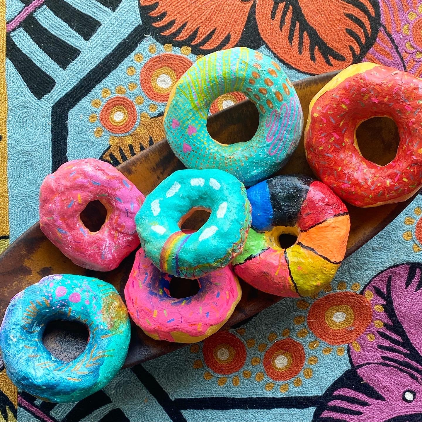 Finished hand painted donuts by class Summer 2022