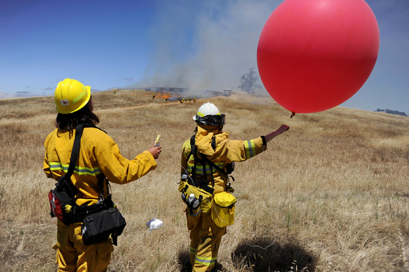 SJSU students launching radiosonde during a prescribed fire, 2012 (Neal Waters Photo).