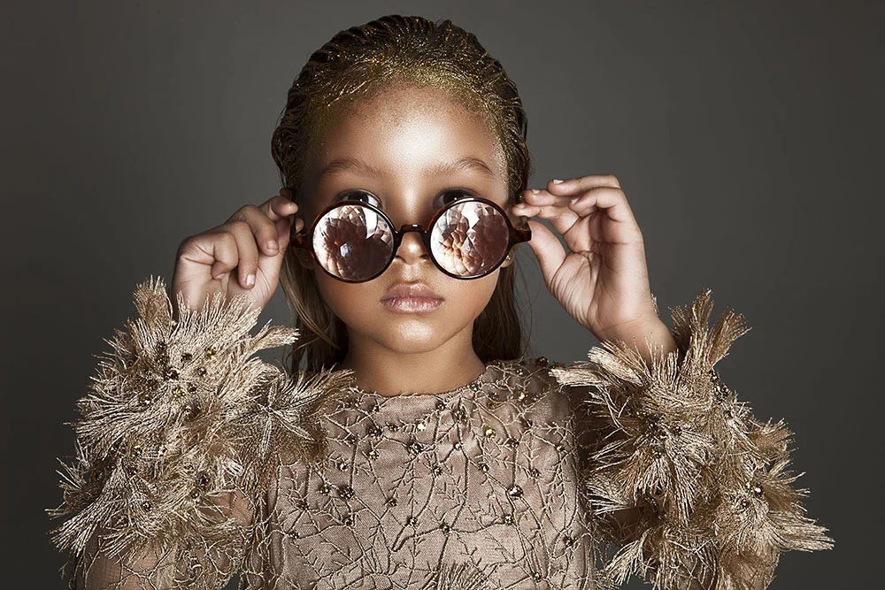 Envisioning what the new year may bring, Harper Tillman looks forward to her future in a Mischka Aoki frock & Future Eye shades. 