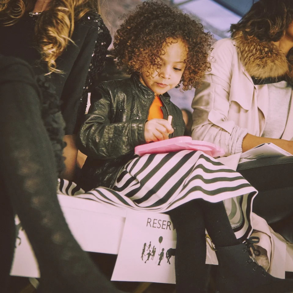 This professional is prepared to take notes on all her favorite pieces, including the Milly dress and Bonnie Young jacket she's sporting.