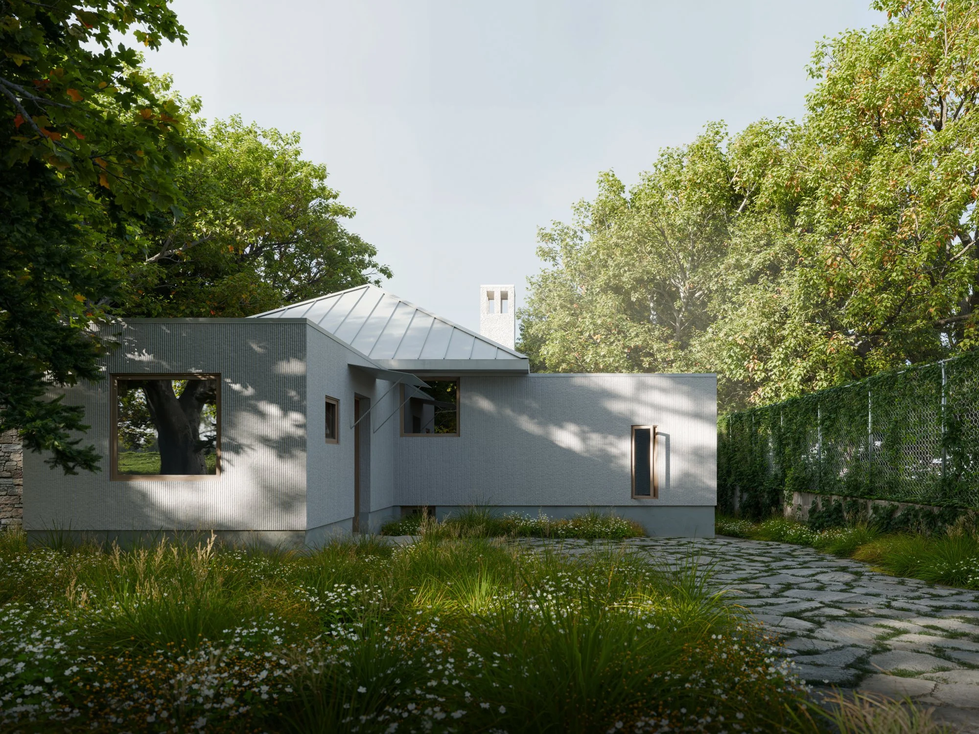 Modern house with white exterior, surrounded by lush green trees, stone pathway, and a grassy yard.