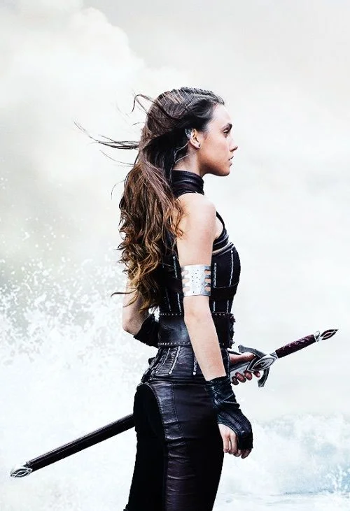 I love the subtle natural elements of the water and sky and wind in her hair. Also love the arm band and wardrobe, and body language of the model - strong but still feminine.