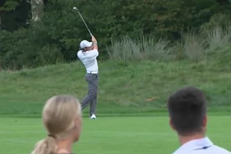 Caroline Wozniacki and Sean O’Flaherty watch McIlroy in action during the FedEx Cup play-offs.