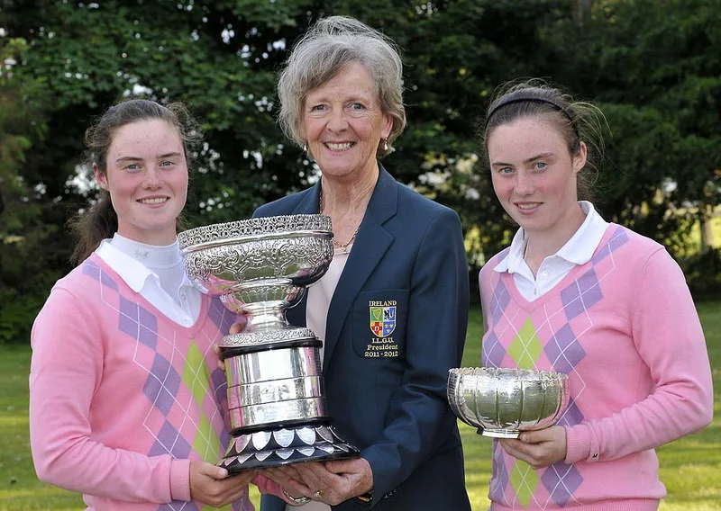  Marjorie McCorduck (President, ILGU) presents Leona Maguire (Slieve Russell) with the 2012 Irish Women's Close Amateur Championship. Also pictured, leading qualifier Lisa Maguire (Slieve Russsell). Picture by Pat Cashman cashmanphotography.ie