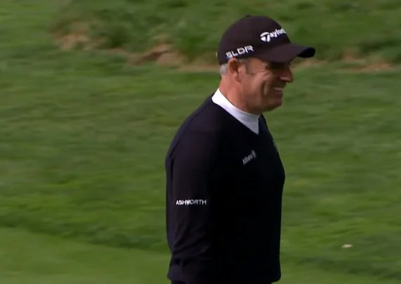 A happy Paul McGinley walks off the fifth green following his birdie two. 