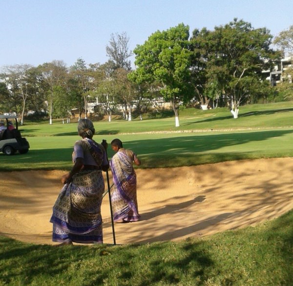 Raking the bunkers in Bangalore. Picture via @DermotMcElroy 