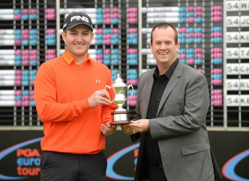 David Booth receives his trophy from EuroPro Director of Operations Daniel Godding. Picture www.europrotour,com