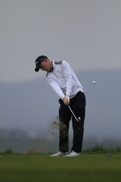 Geoff Lenehan strikes another crisp iron shot. Picture: Thos Caffrey / www.golffile.ie
