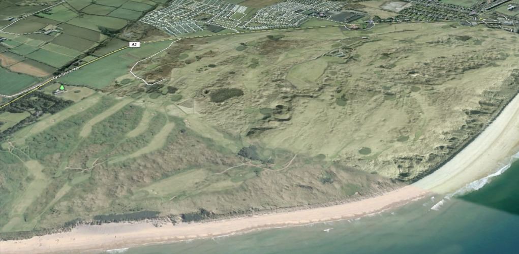An aerial view of Royal Portrush with the fifth green on the Dunluce Links visible in the bottom left hand corner.