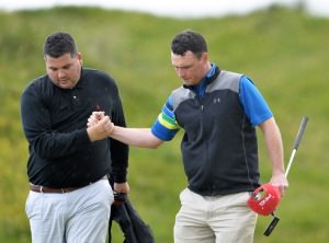 Eoin Arthurs (Forrest Little) with his caddy Dan Whelan celebrate victory on the 18th during the third round of matchplay at the 2014 AIG sponsored Irish Amateur Close Golf Championship at Seapoint Golf Club today (10/06/2014). Picture by Pat Cashman www.cashmanphotography.ie