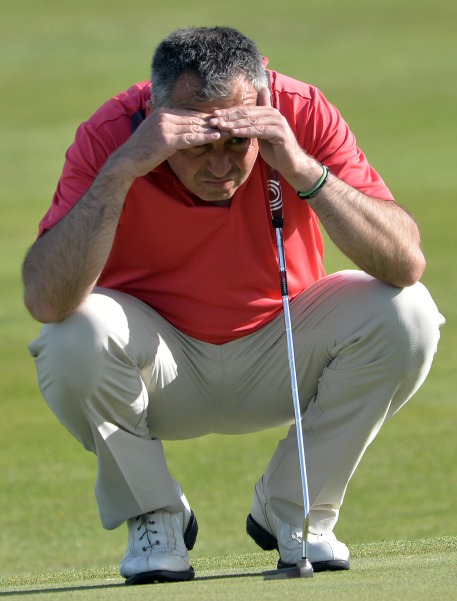 Pat Murray (Limerick) lining up his putt on the 18th during his quarter final match at the 2014 AIG sponsored Irish Amateur Close Golf Championship at Seapoint Golf Club today (10/06/2014). Picture by Pat Cashman