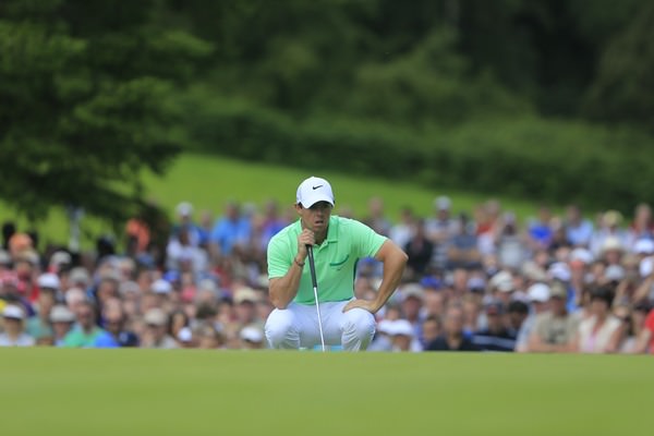 Rory McIlroy lines up his birdie putt on the ninth in the first round of the Irish Open. Picture: Fran Caffrey www.golffile.ie
