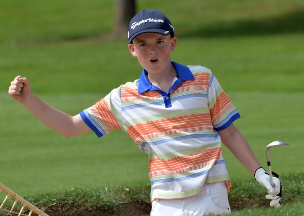 Max Kennedy (The Royal Dublin) show his delight at nearly holing from the bunker at the 17th green during the Leinster Boys' Under 13 Open Championship at Corrstown Golf Club (21/07/2014). Picture by Pat Cashman