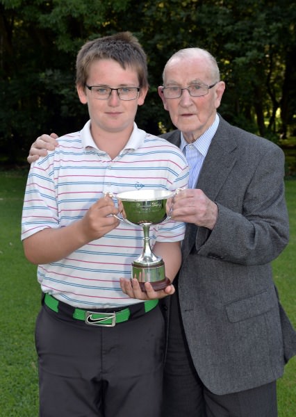 Winner Patrick Callaghan (Castle Dargan) pictured with Paddy Craddock after his victory in the 2014 Irish Boys Under 13 Amateur Open Championship (Craddock Trophy) at Malahide Golf Club (11/08/2014). Picture by Pat Cashman