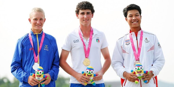 Sweden’s Marcus Kinhult., Italy's Renato Paratore and Thailand’s Danthai Boonma show off their Olympic medals