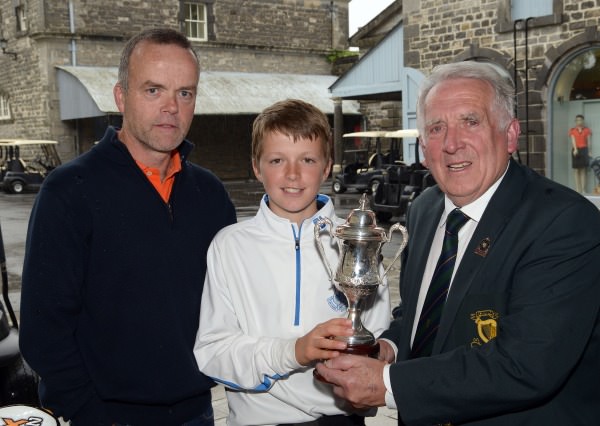 John Ferriter (Hon Secretary, Leinster Golf) presenting Ronan Cowhey (Elm Park) with the Titleist sponsored 2014 Leinster Boys Under 13 Series trophy after his victory at Carton House Golf Club today (21/08/2014). Also in the picture is David Cowhey (Dad). Picture by Pat Cashman