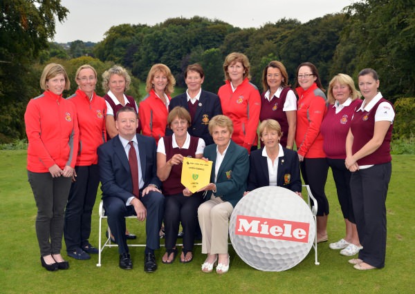 Vonnie Noonan (ILGU Board Member) presenting Sylvia Alcock (Lady Captain, Skerries Golf Club) with the 2014 Miele All Ireland Ladies Interclub Fourball Regional Final pennant after their victory at Athlone Golf Club. Also in the picture in front are Pat McGrath (Miele Ireland) and Lily O'Sullivan (Lady Captain, Athlone Golf Club). At back (from left) Tara Duggan, Barbara Ryan, Mary Kenny, Joyce Gillespie, Christine O'Brien (Lady President, Skerries Golf Club), Bridgeen Kiernay, Grainne O'Connor, Joanne Kinsella, Nuala MacMahon (Team Manager) and Fiona Farrell. Picture by Pat Cashman